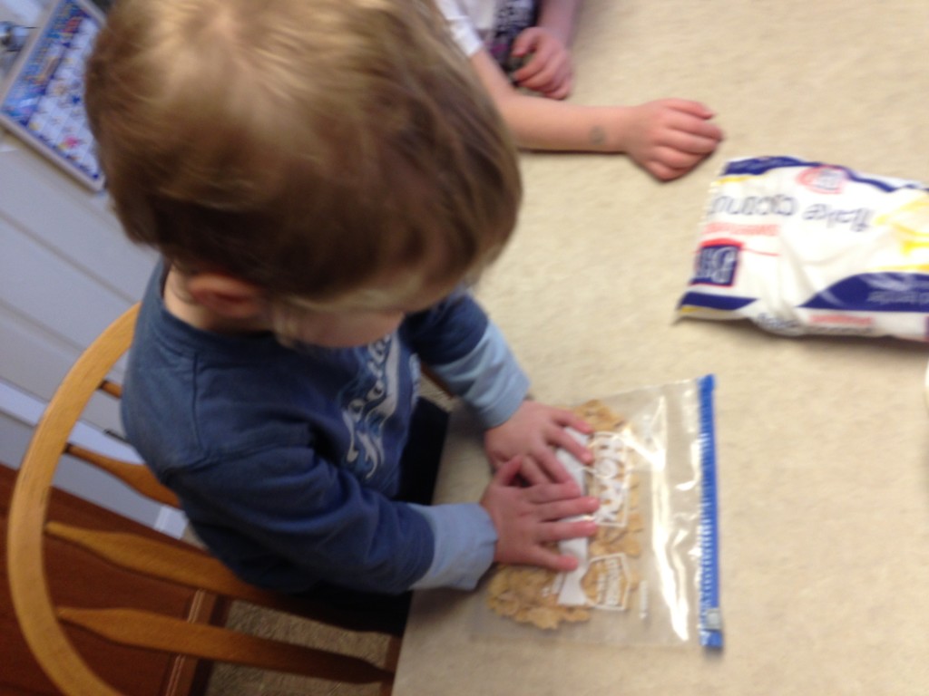 yogurt bites with toddlers - crushing cereal