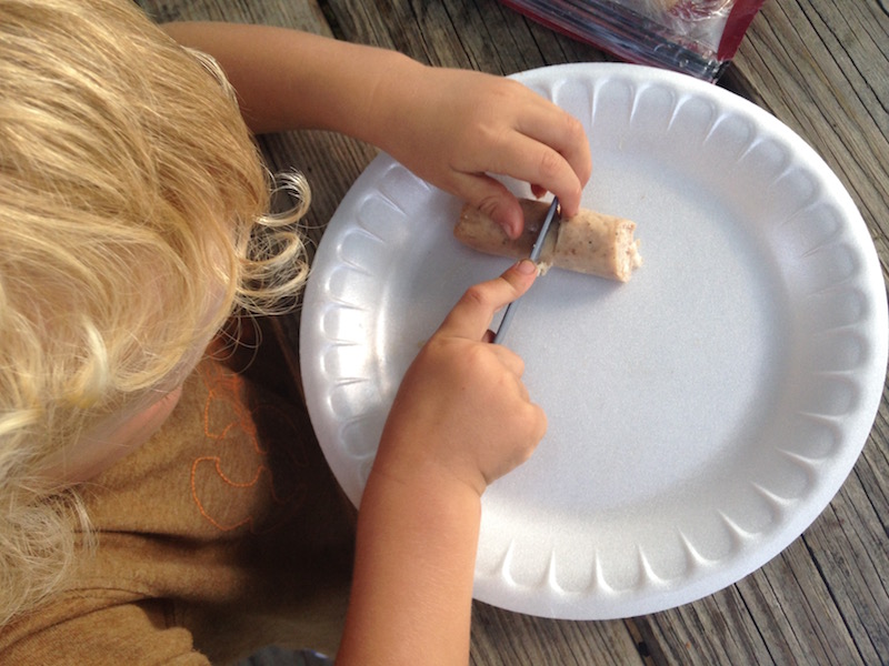 first camping trip with kids success getting kids involved using plastic knife